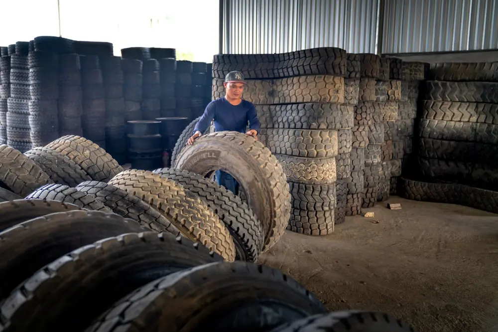 Tire being rolled into the shop