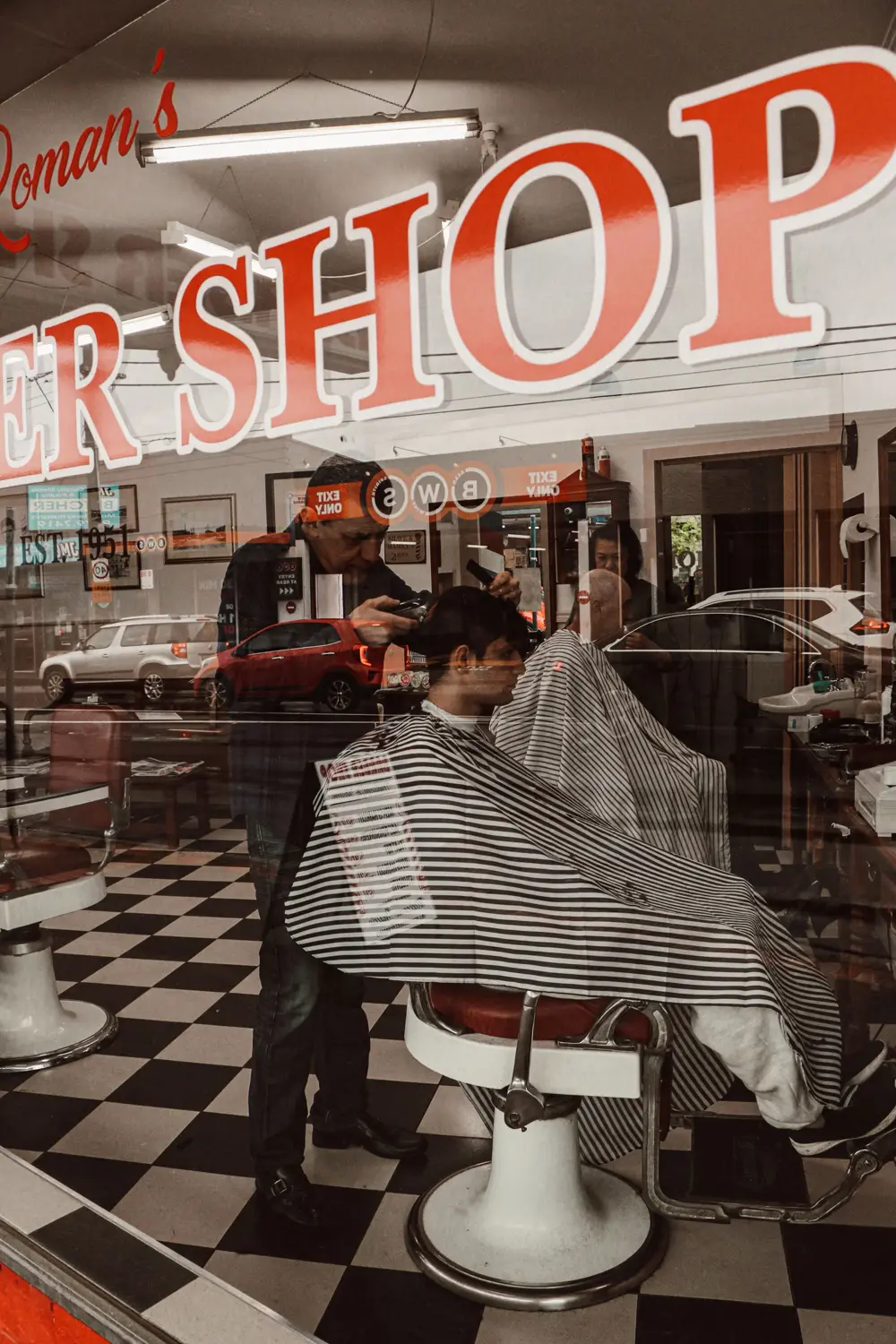 Barber cutting a man's hair