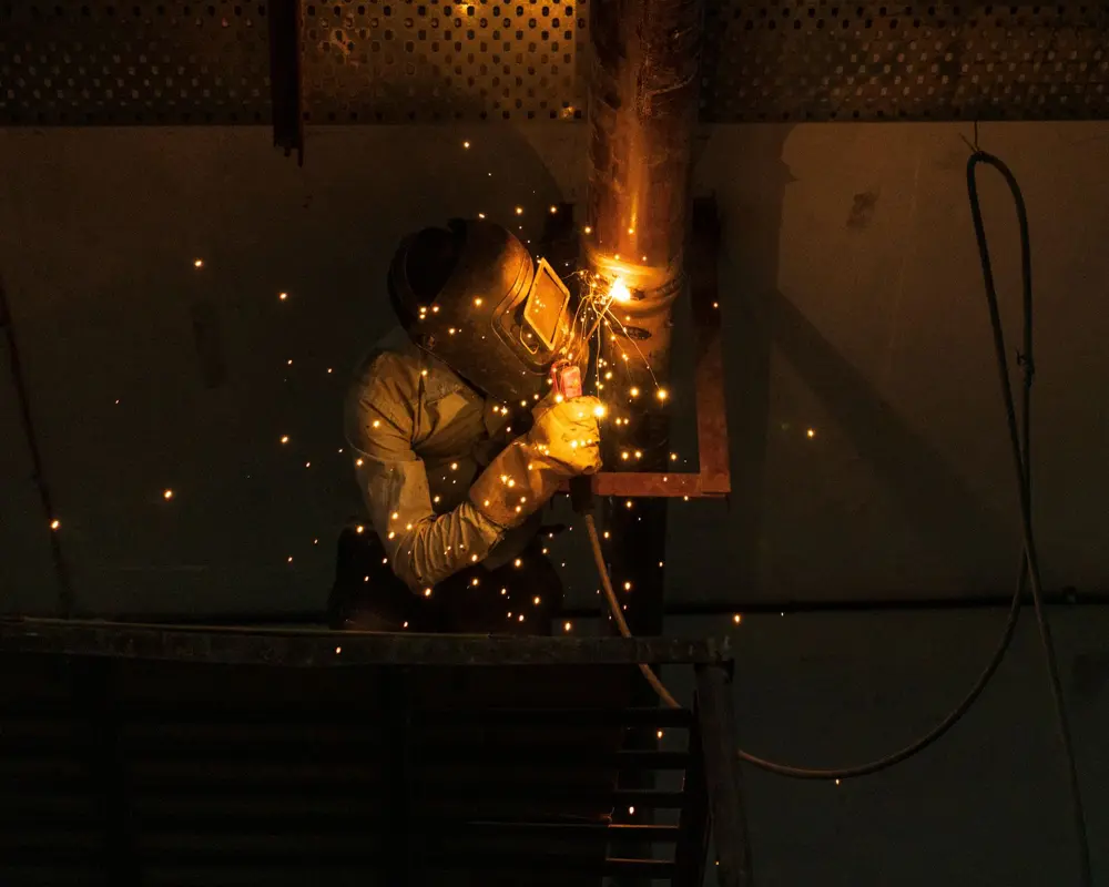 Welder working with sparks