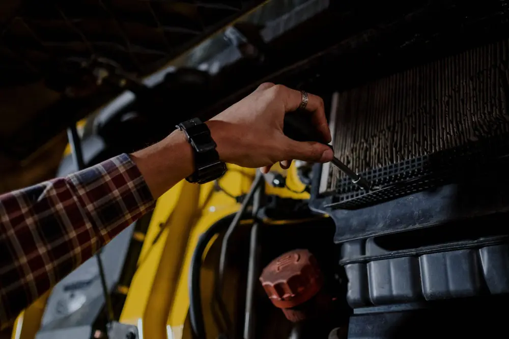 Mechanic working on a truck engine