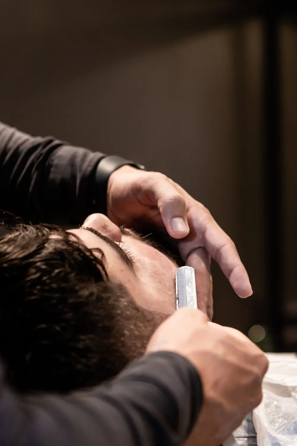 Barber using a straight razor