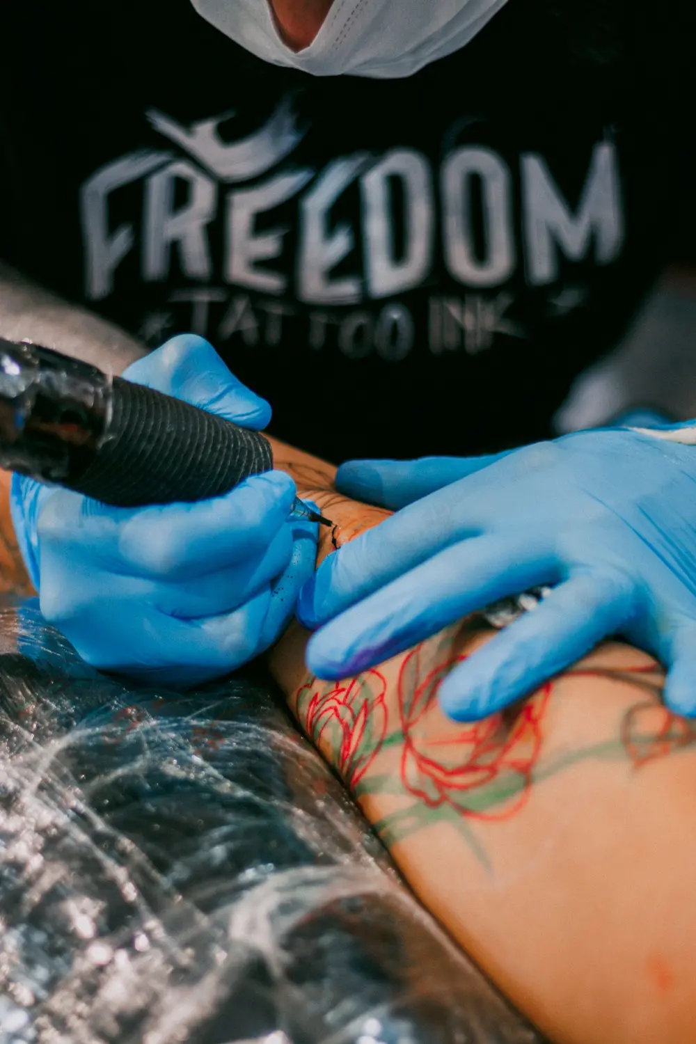 Close-up of a colorful tattoo in progress